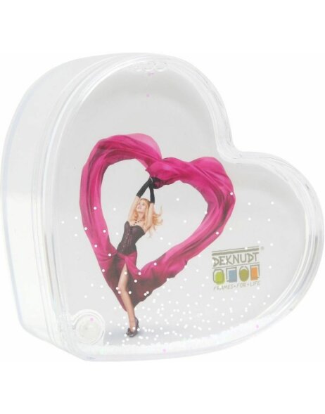Photo tin heart shaped with snow and tinsel